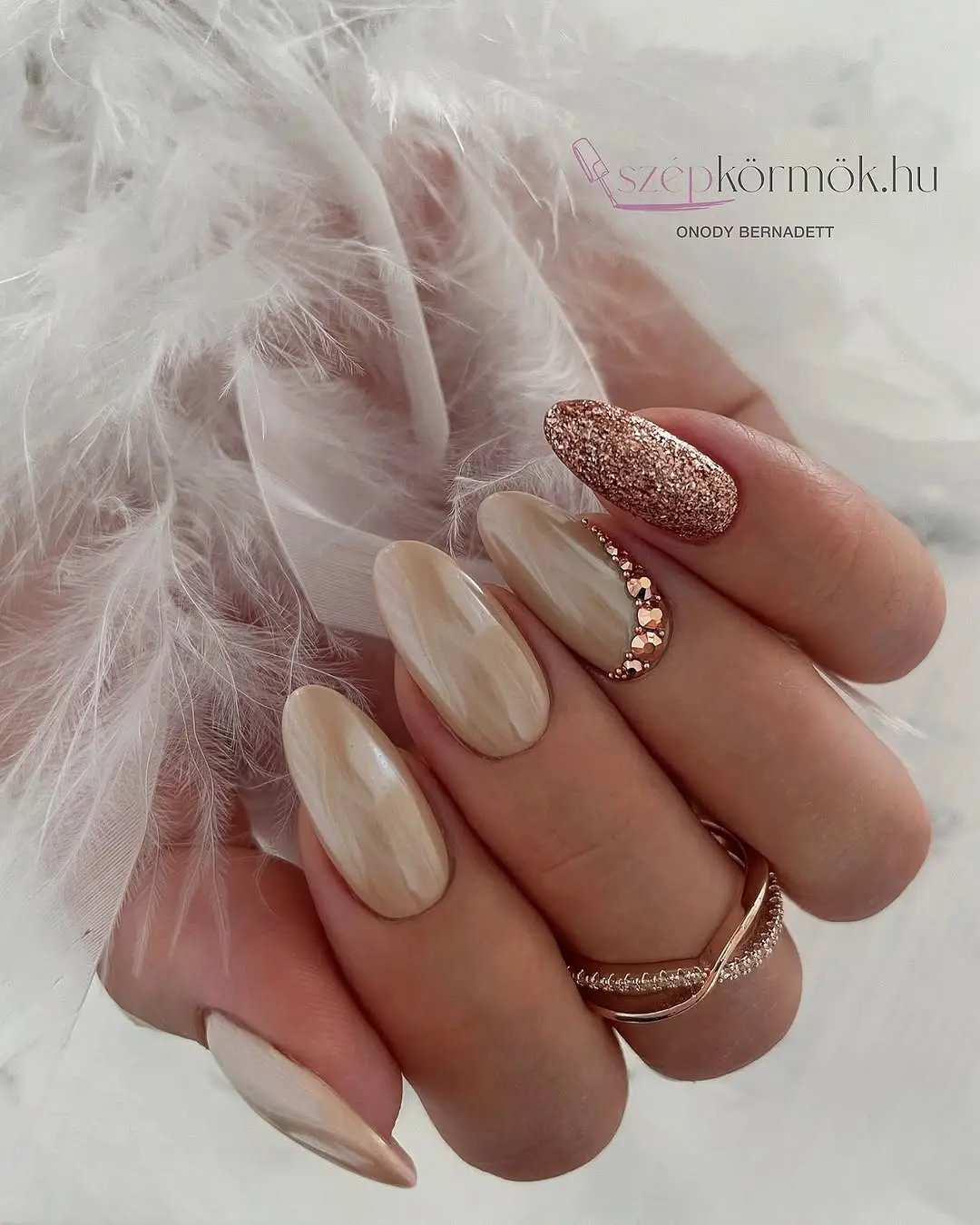 Elegant beige nails with glitter accent