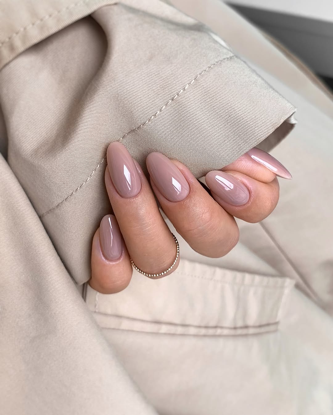 Elegant beige nails with a glossy finish