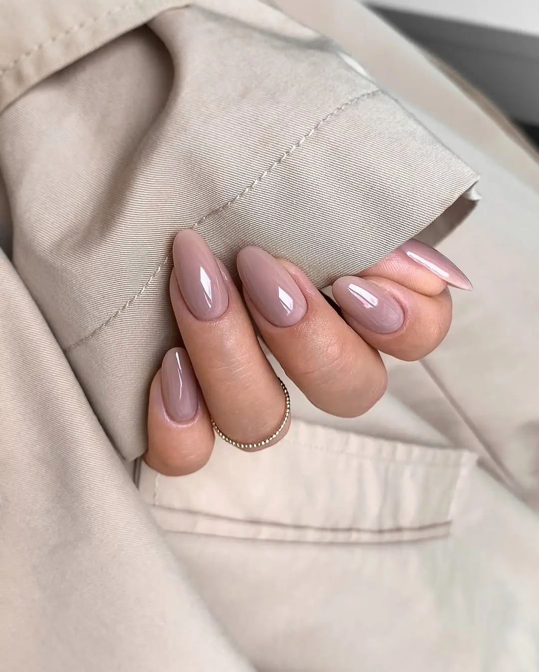 Elegant beige nails with a glossy finish