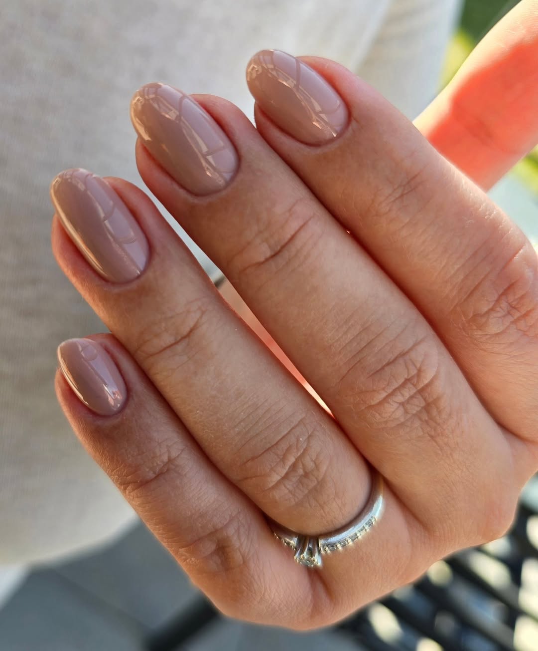 Chic glossy beige manicure with elegant vibes