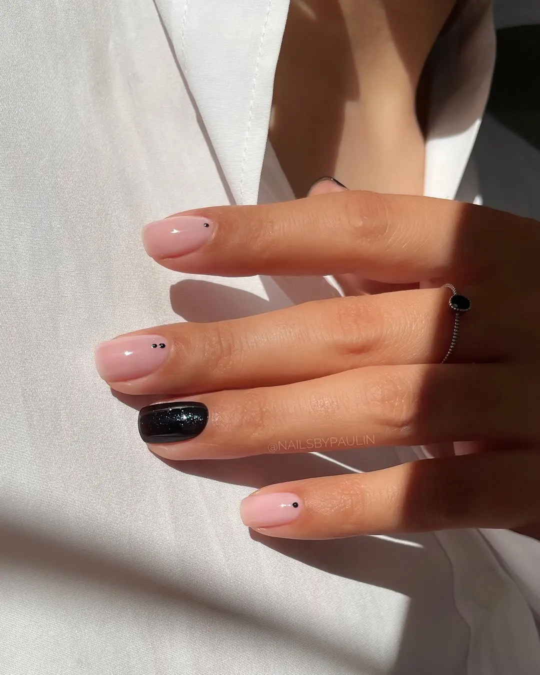 Stylish Beige Nails with Chic Black Accents