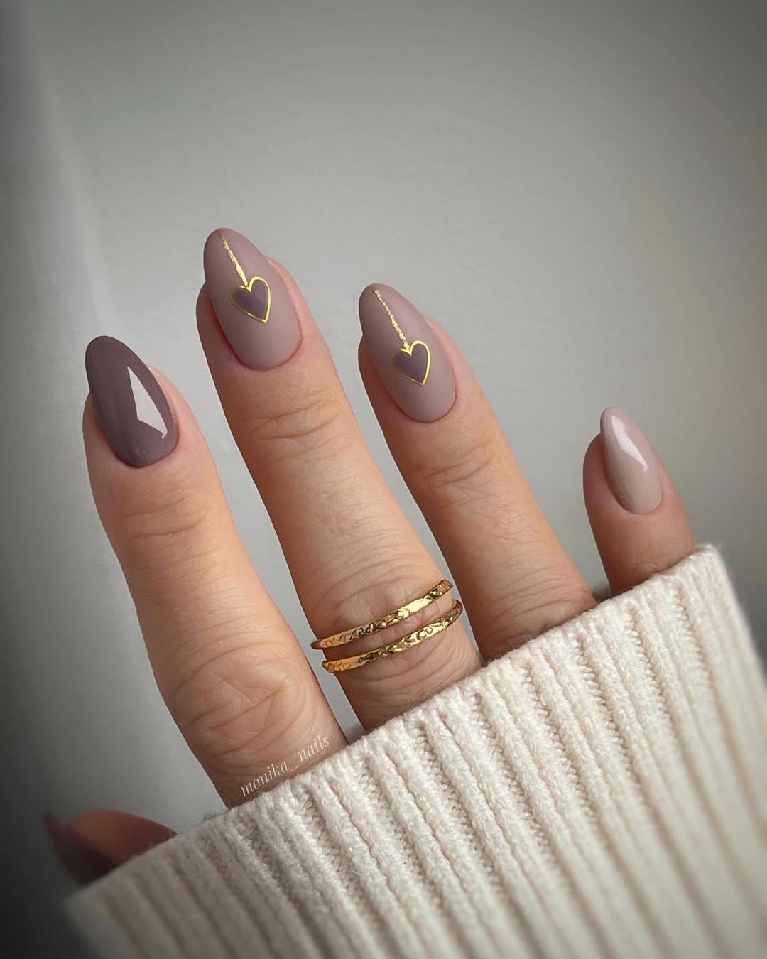 Chic beige nails with gold heart accents