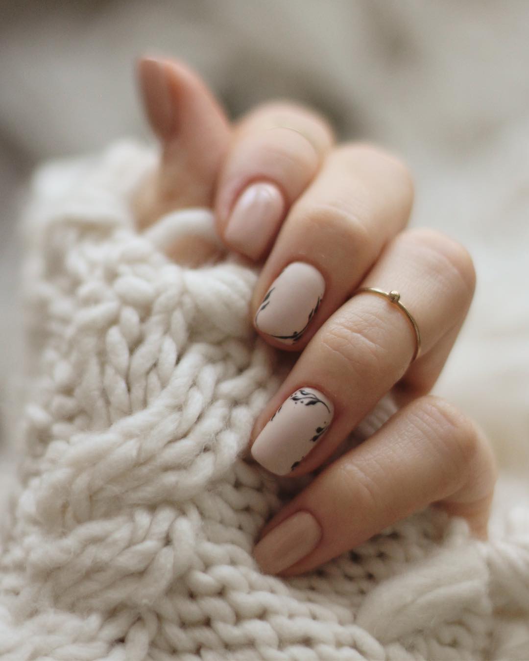 Stylish beige nails with marble accents