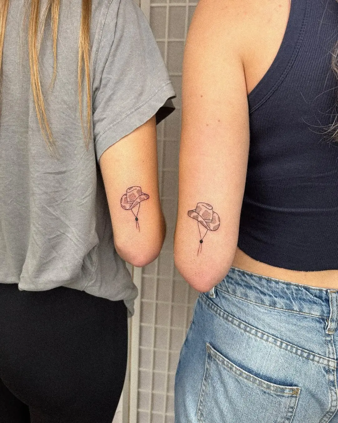 Matching cowboy hat tattoos for best friends