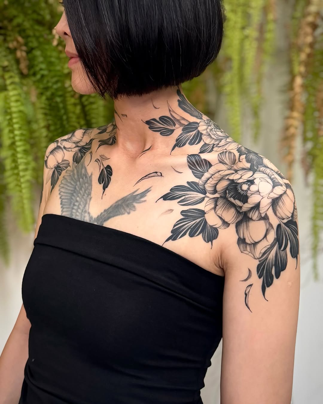 Elegant floral shoulder tattoo showcasing intricate details