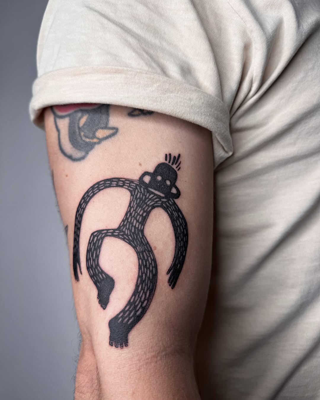 Whimsical monkey tattoo with unique patterns