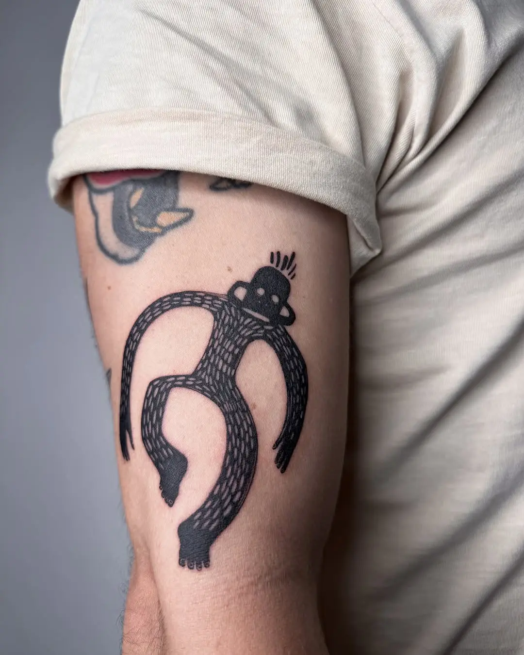 Whimsical monkey tattoo with unique patterns