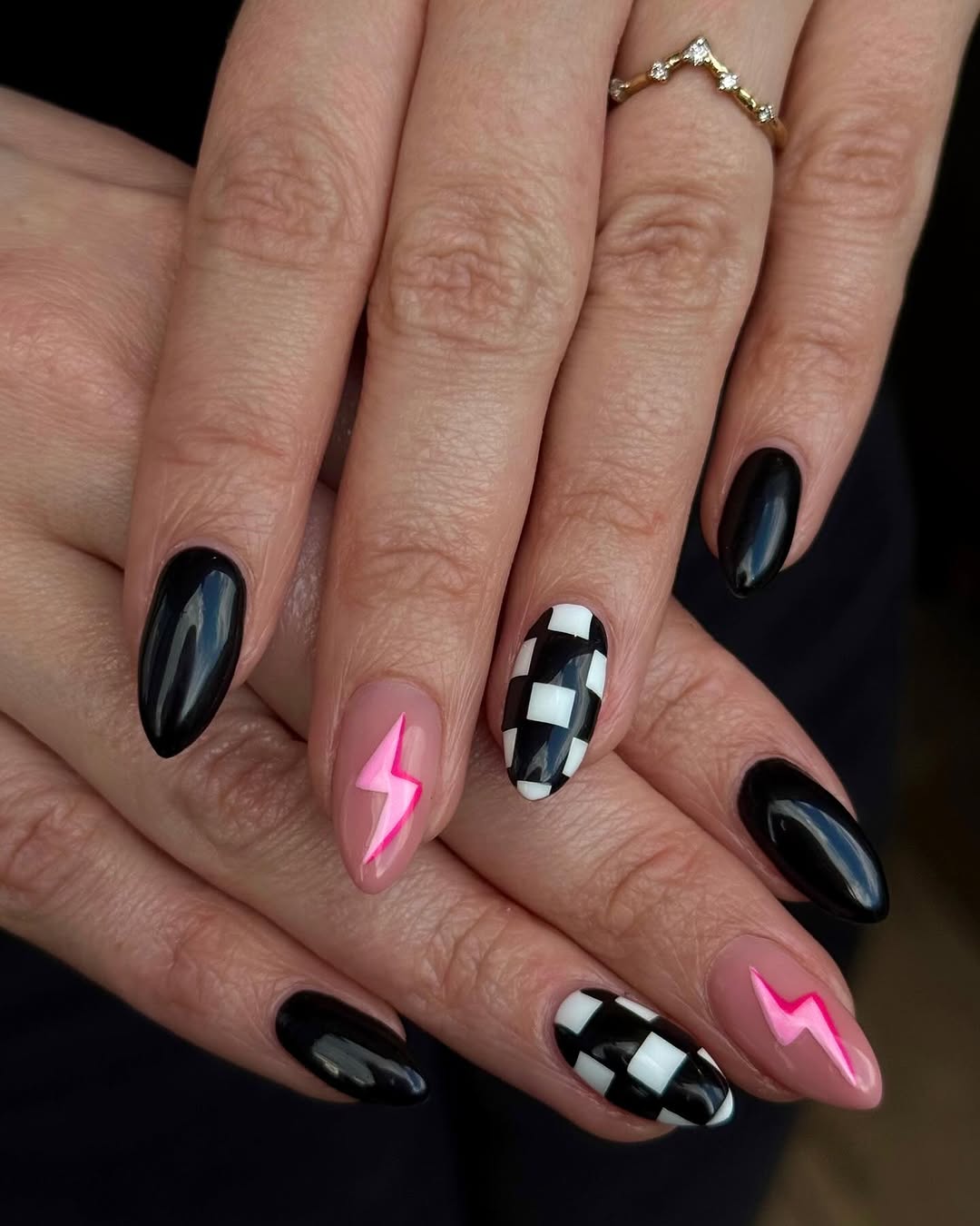 Stylish black nails with vibrant pink accents