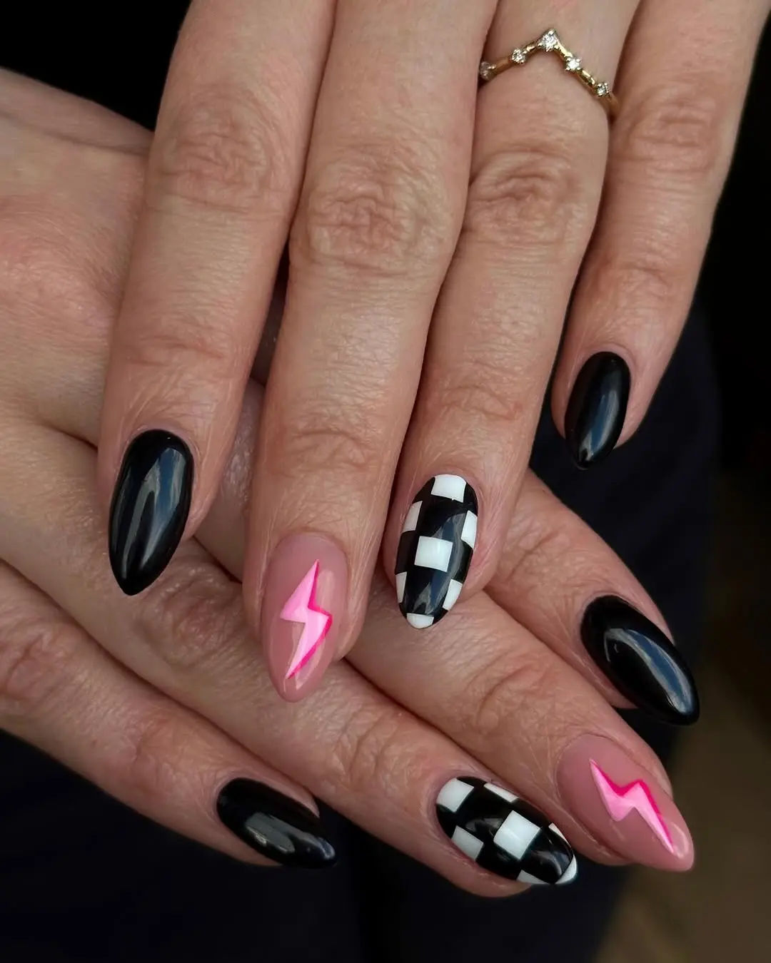 Stylish black nails with vibrant pink accents