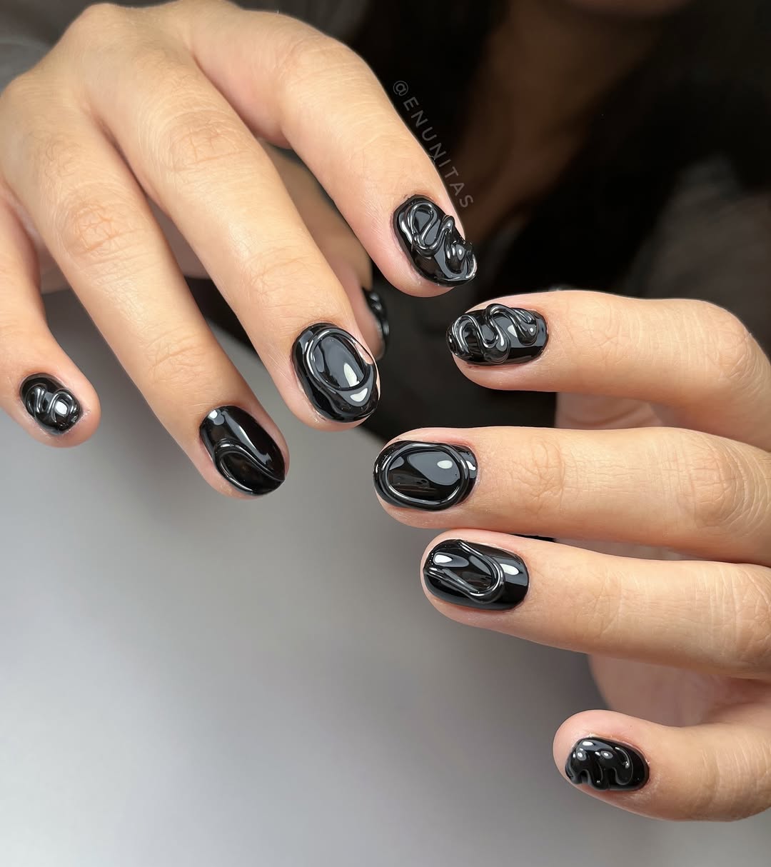 Stunning black nails with unique textures and shapes