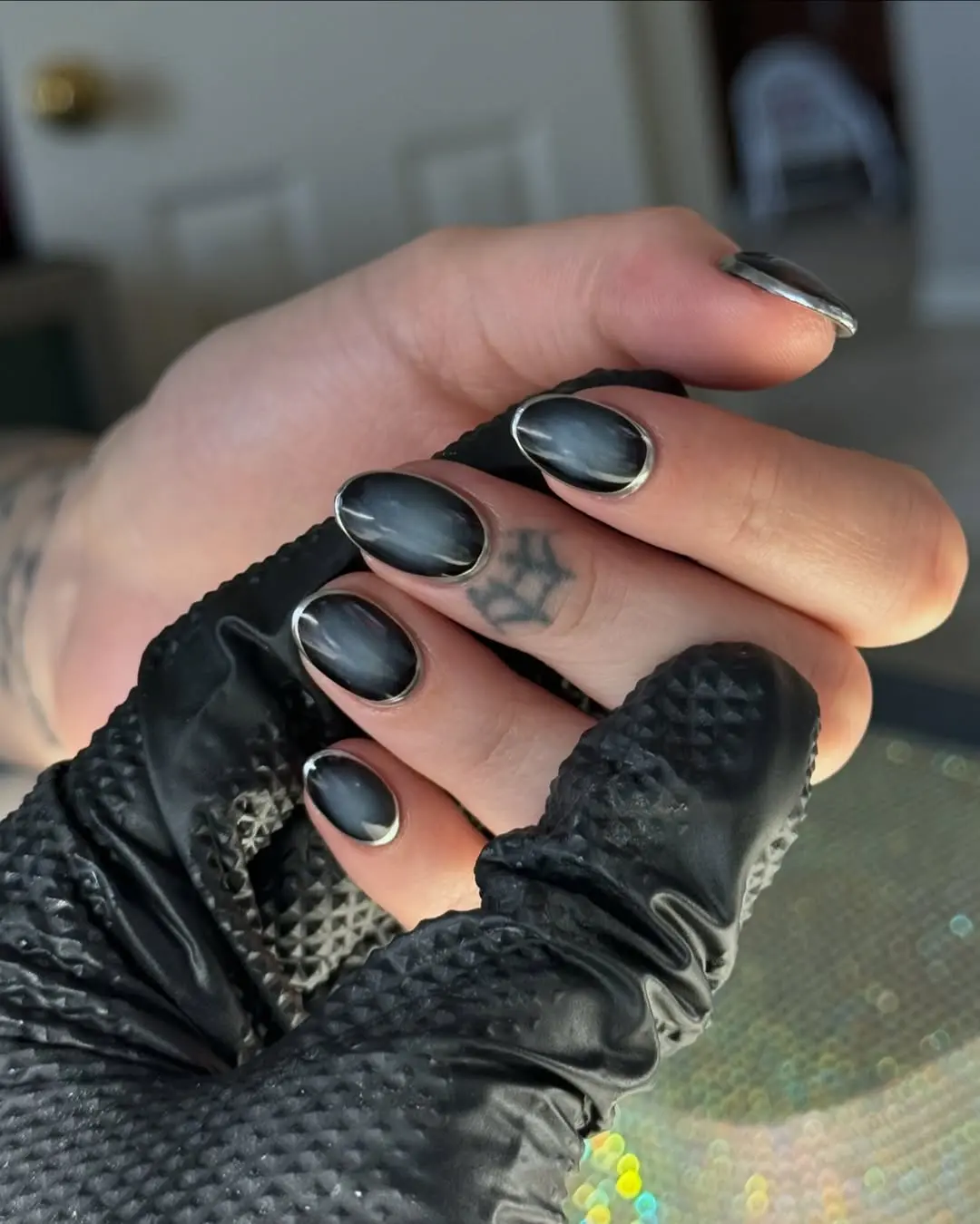 Stunning glossy black stiletto nail design