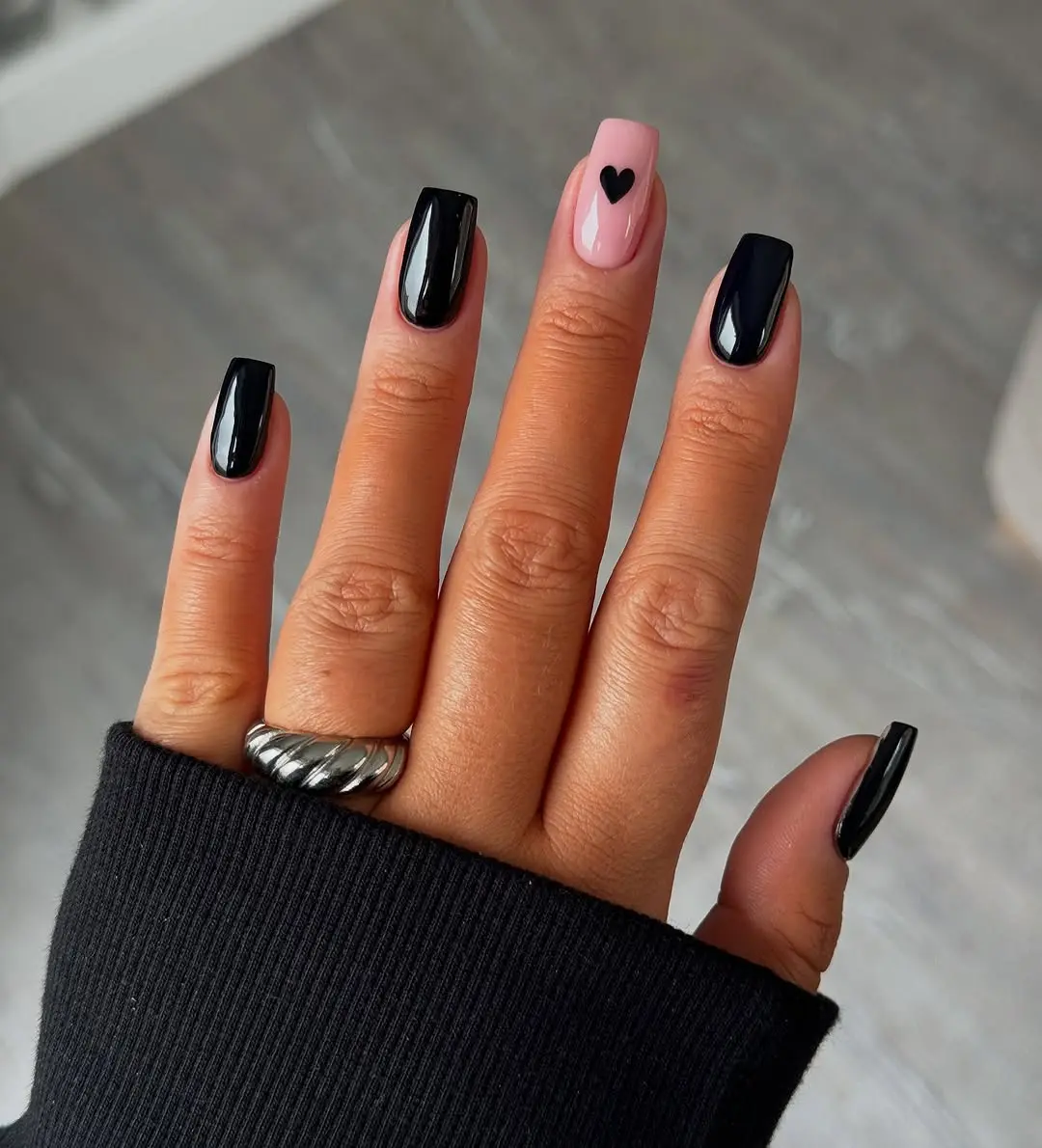 Chic Black Nails with Sweet Pink Accent