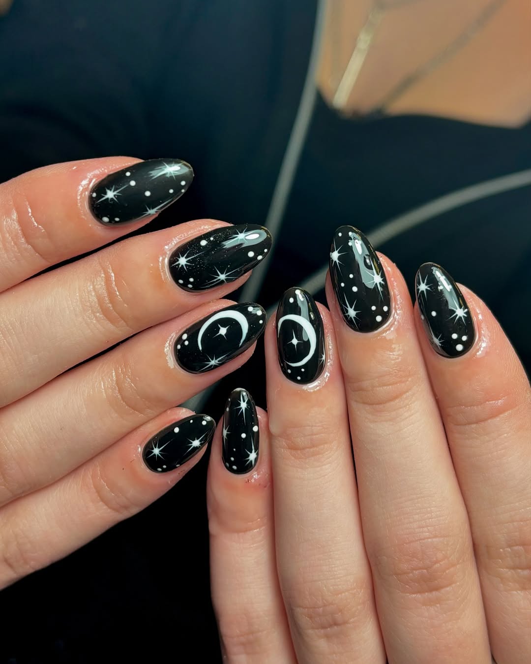 Starry black nails for a cosmic vibe