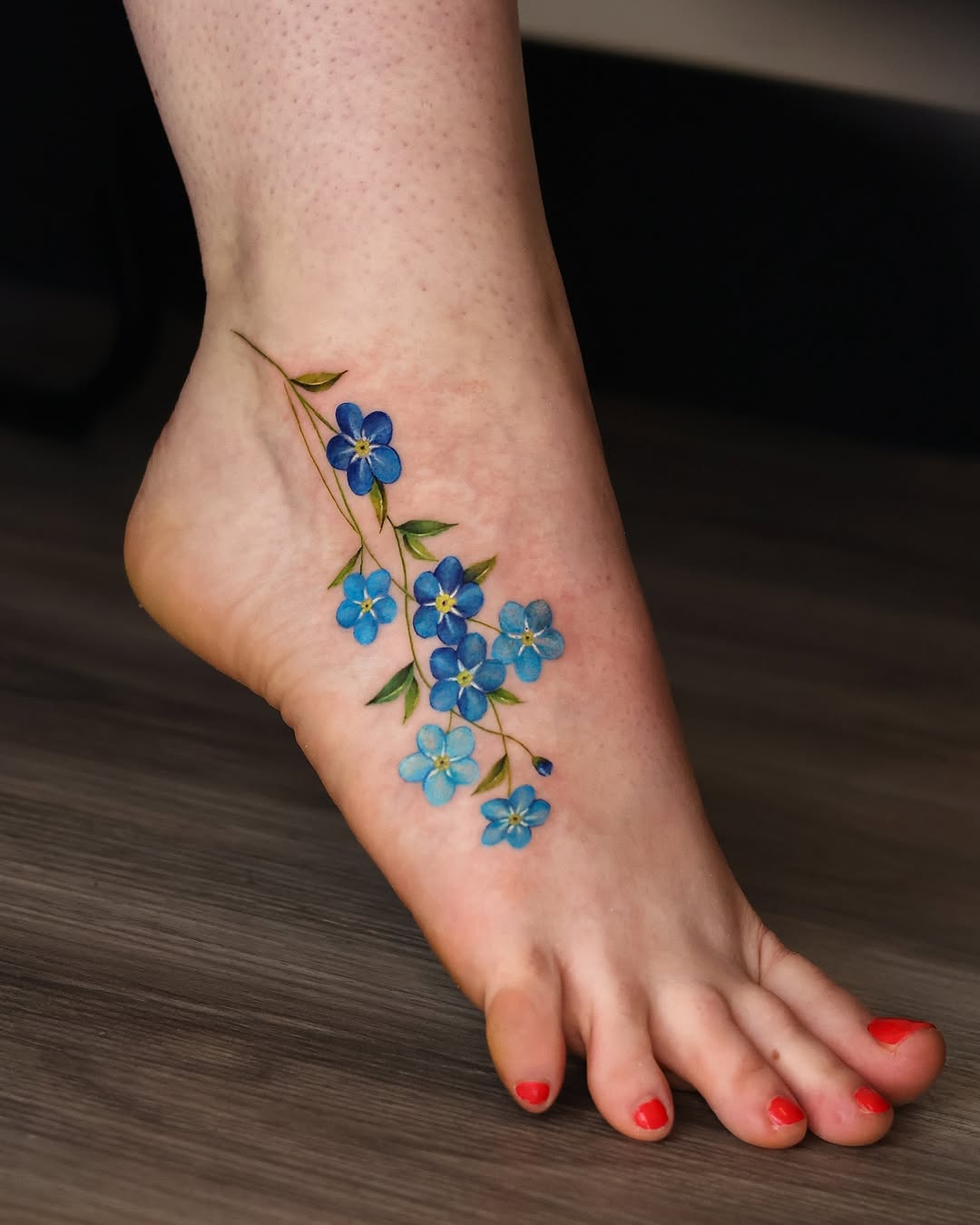 Elegant blue flowers adorning the foot