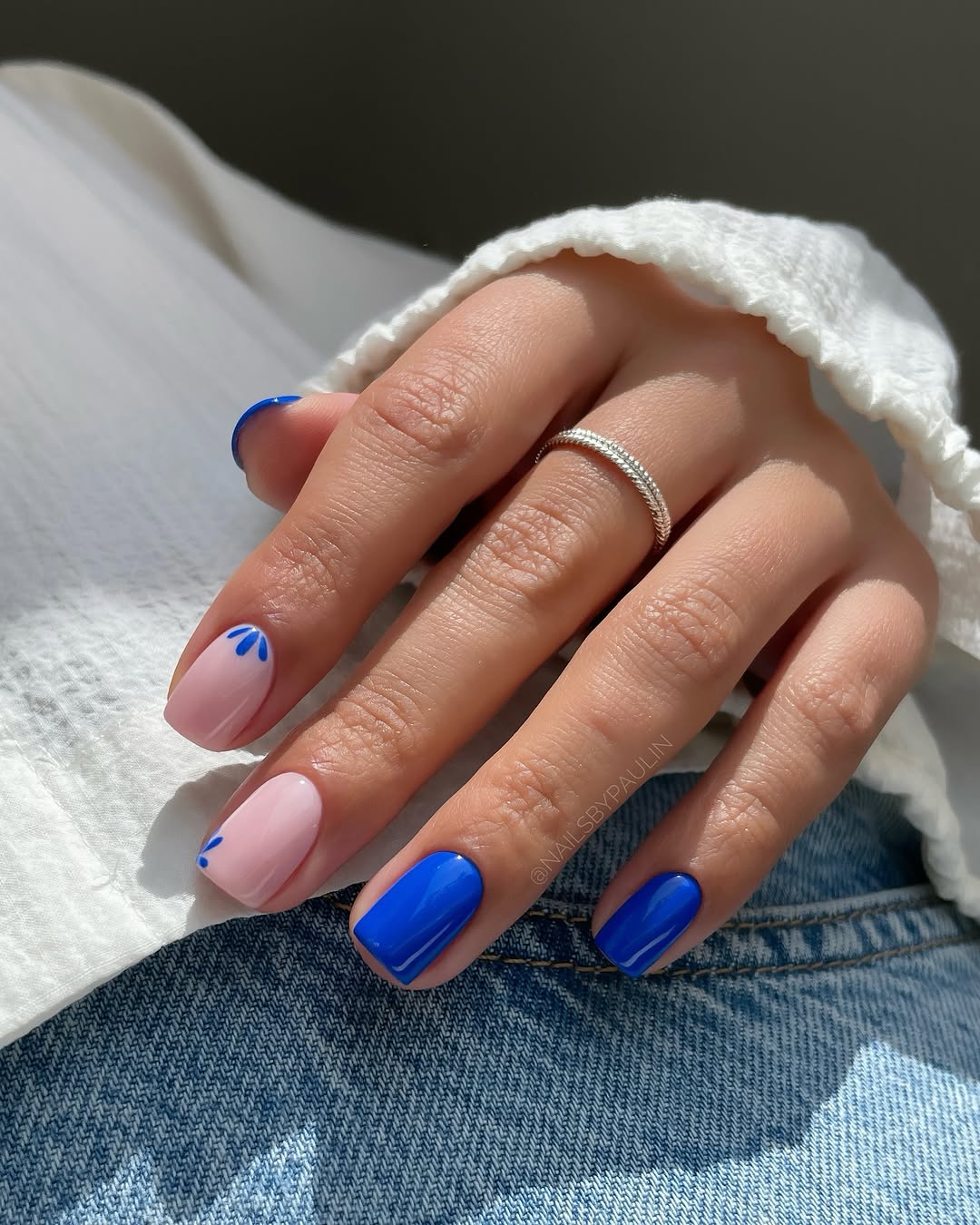 Stylish blue nail art with subtle accents