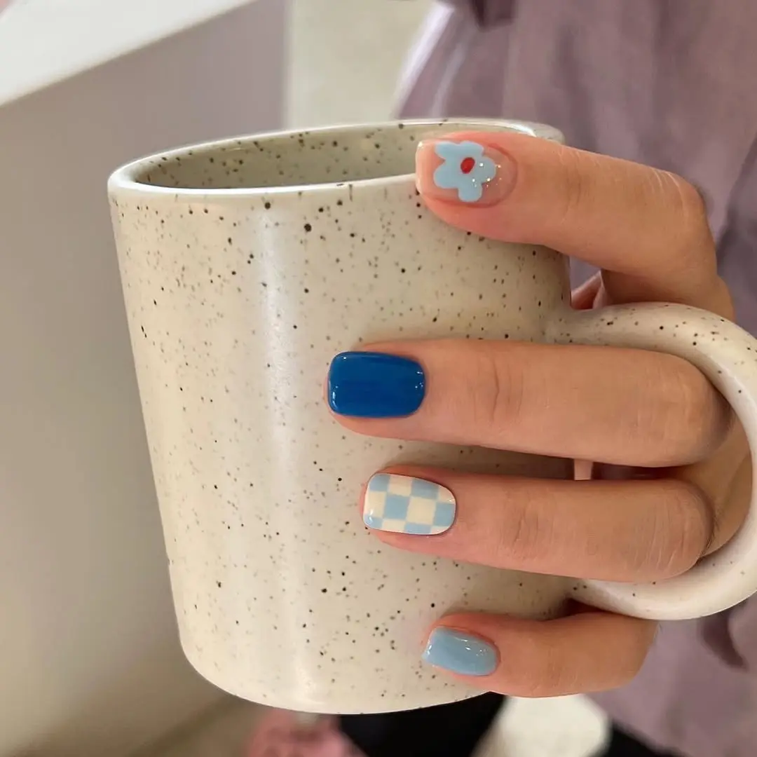 Chic blue nails with playful designs