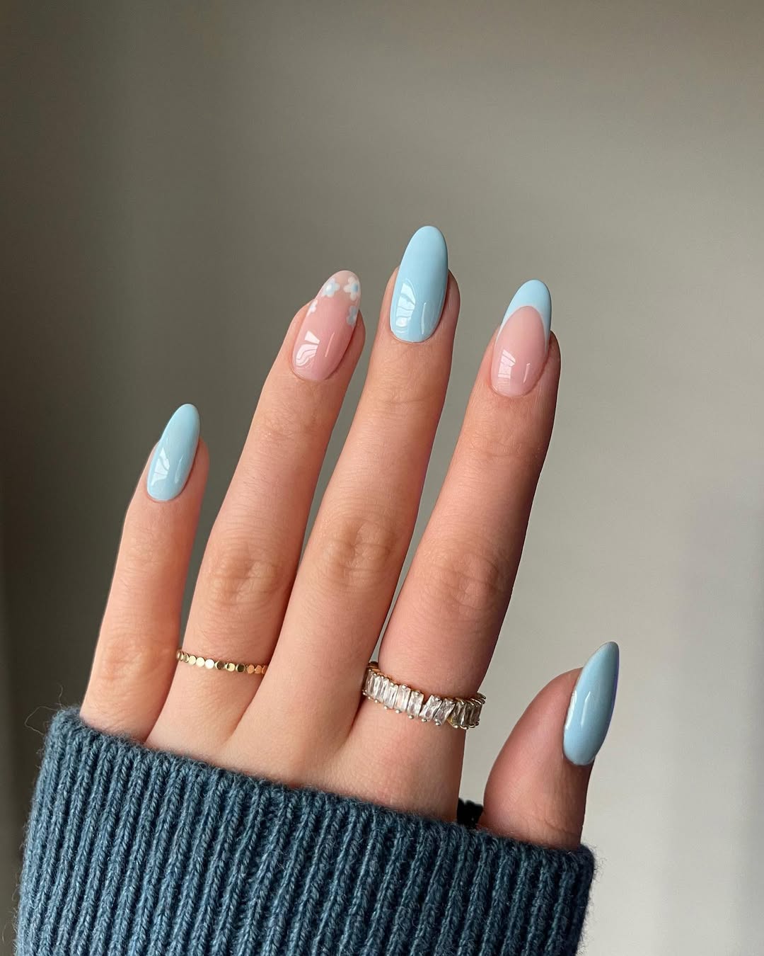 Charming pastel blue nail design with accents
