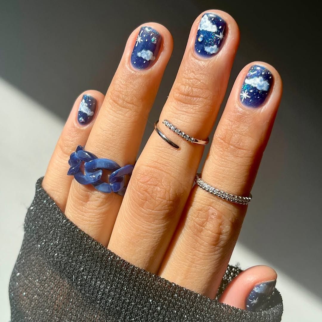 Stunning blue nails with starry accents