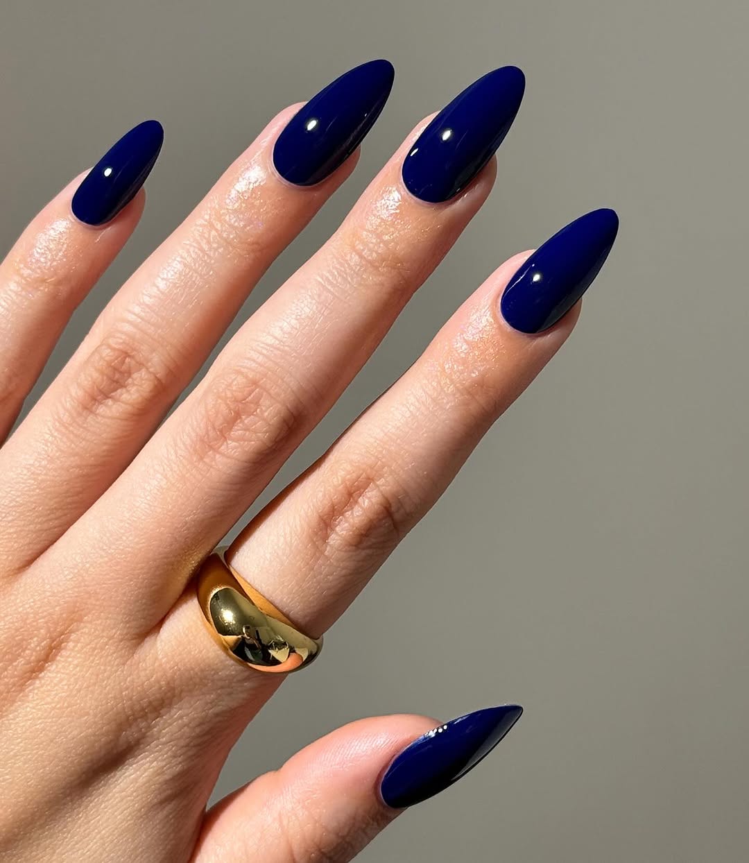 Gorgeous glossy blue almond-shaped nails