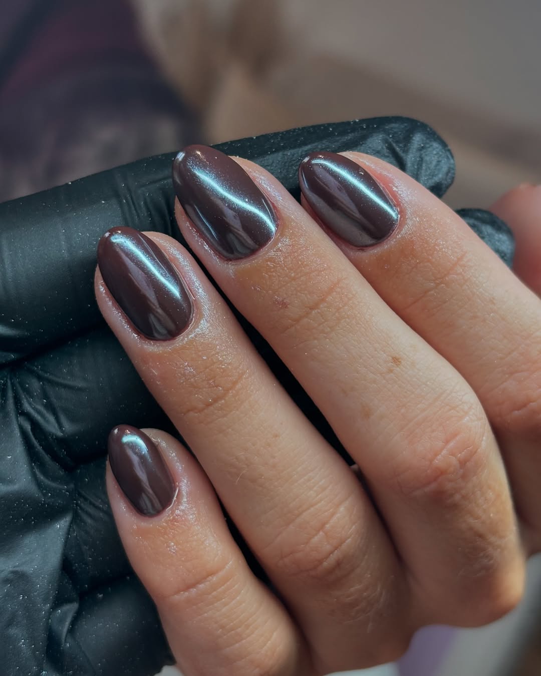 Shiny brown almond-shaped nails for elegance