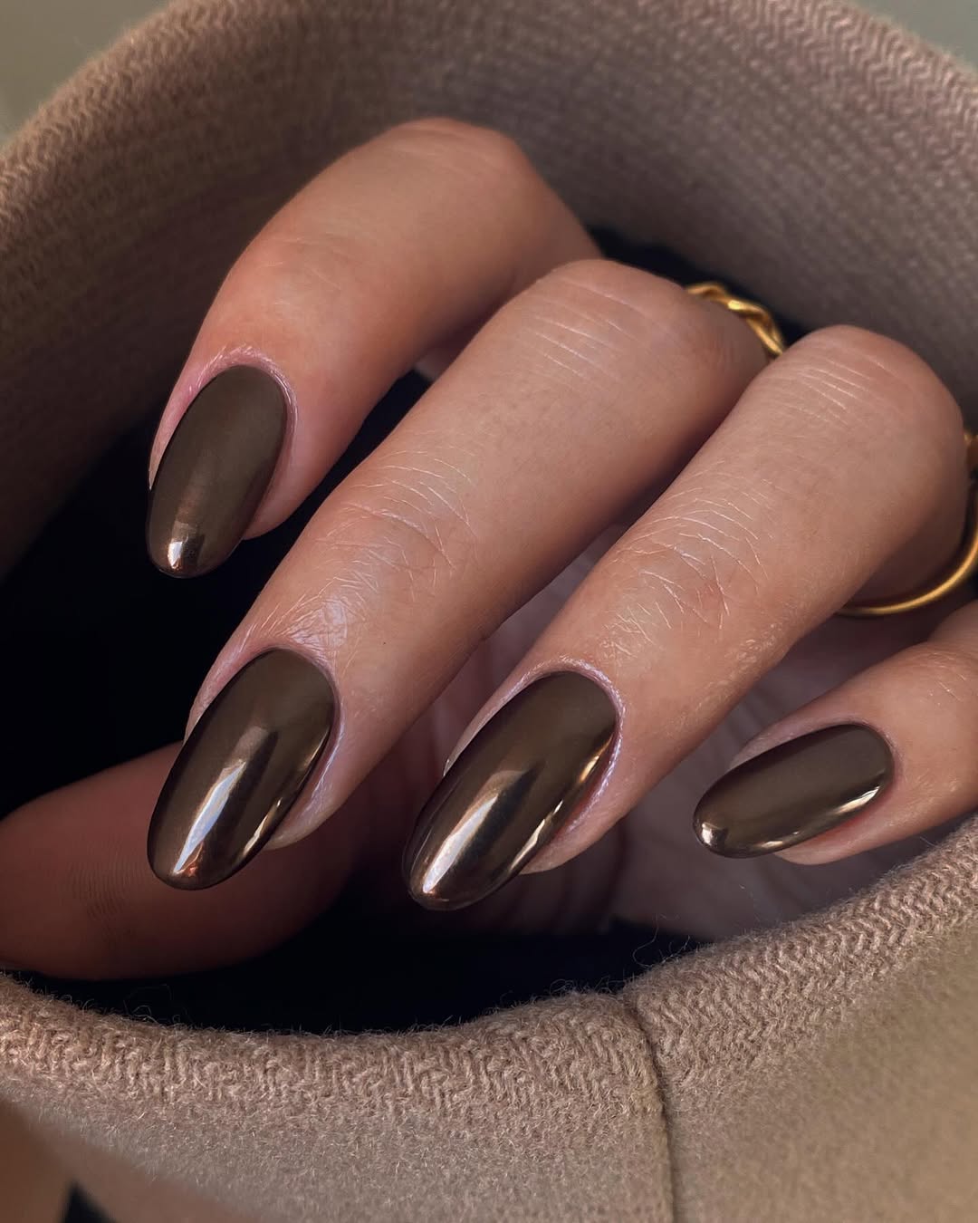 Elegant glossy brown almond-shaped nails