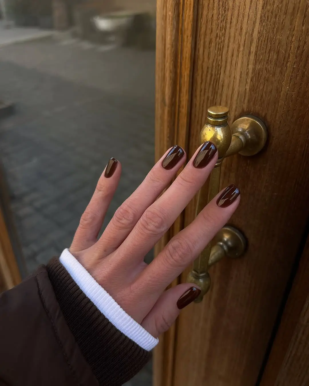 Stylish brown nails on a winter day
