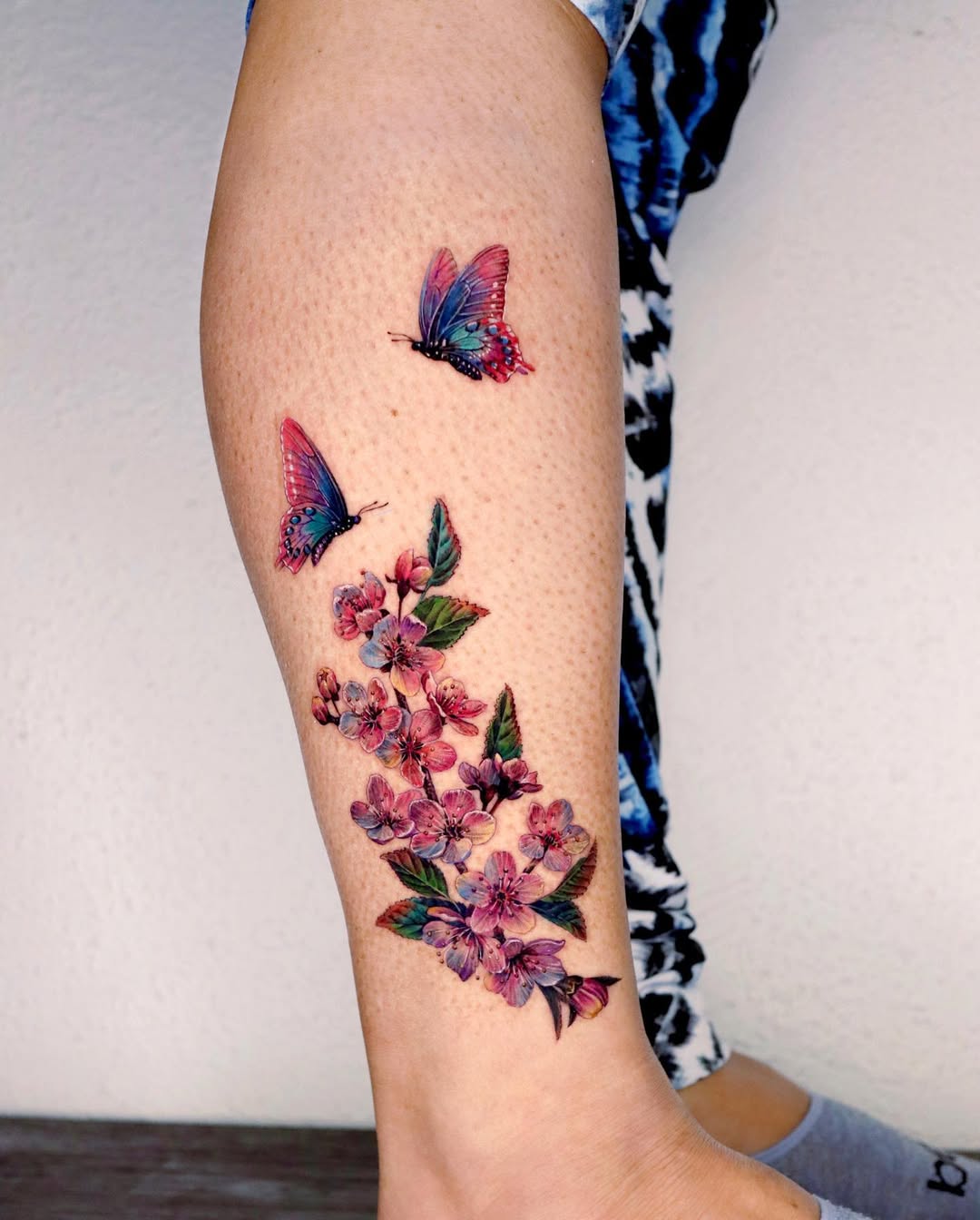 Stunning Floral and Butterfly Leg Tattoo Design