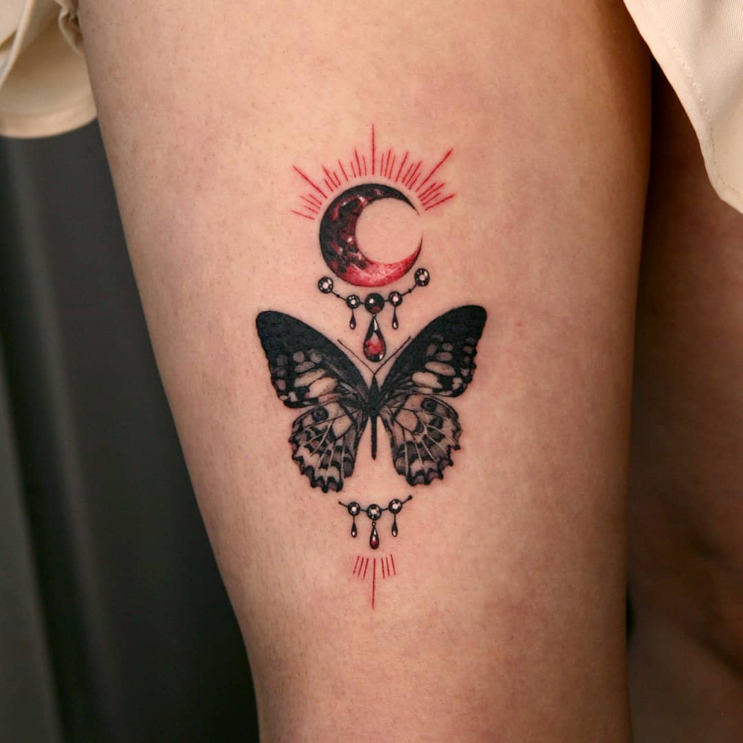 Stunning butterfly tattoo with celestial elements