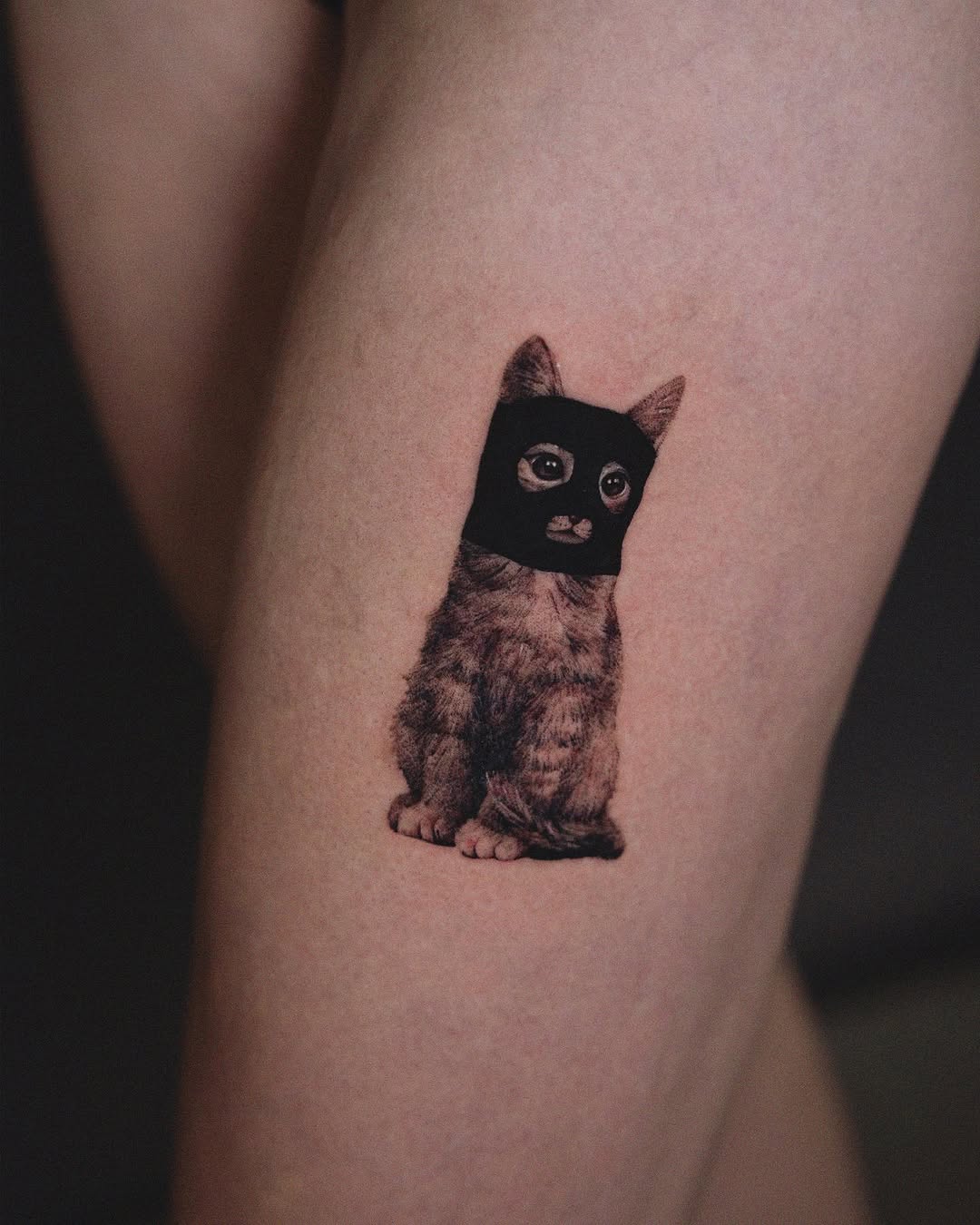 Playful Cat Tattoo for Leg Enthusiasts