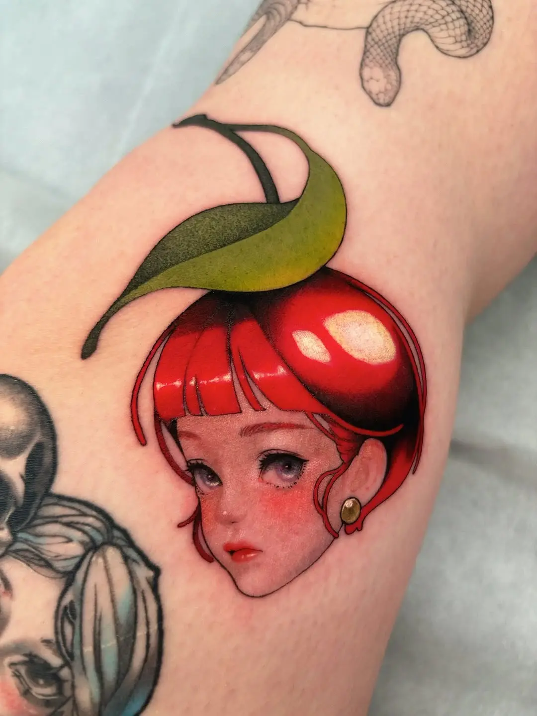 Vibrant Cherry-Headed Girl Knee Tattoo