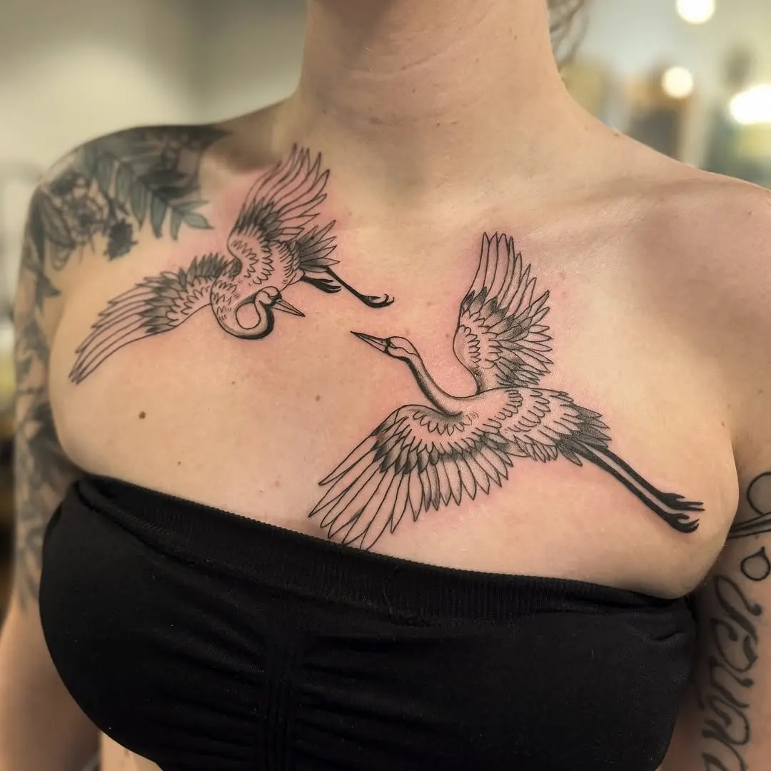 Elegant cranes soaring across the chest