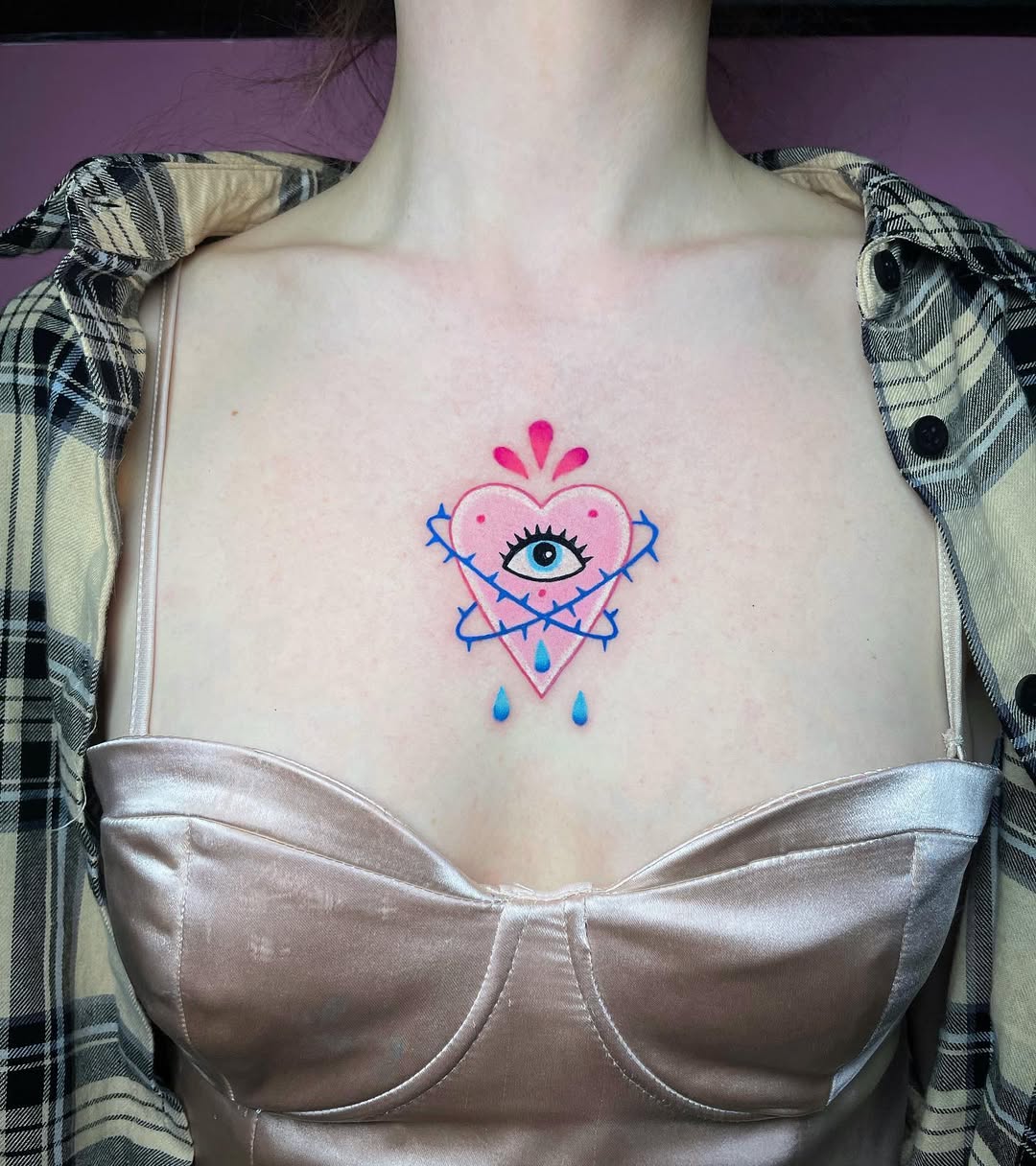 Colorful heart and eye chest tattoo design