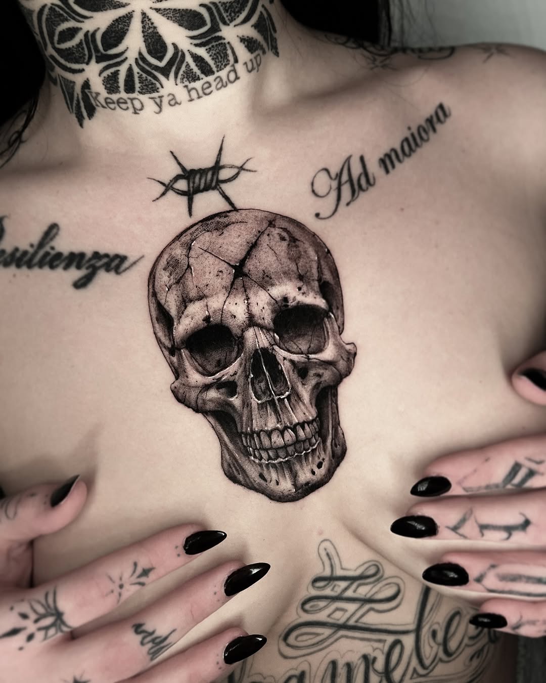 Intricate skull tattoo sits boldly on chest