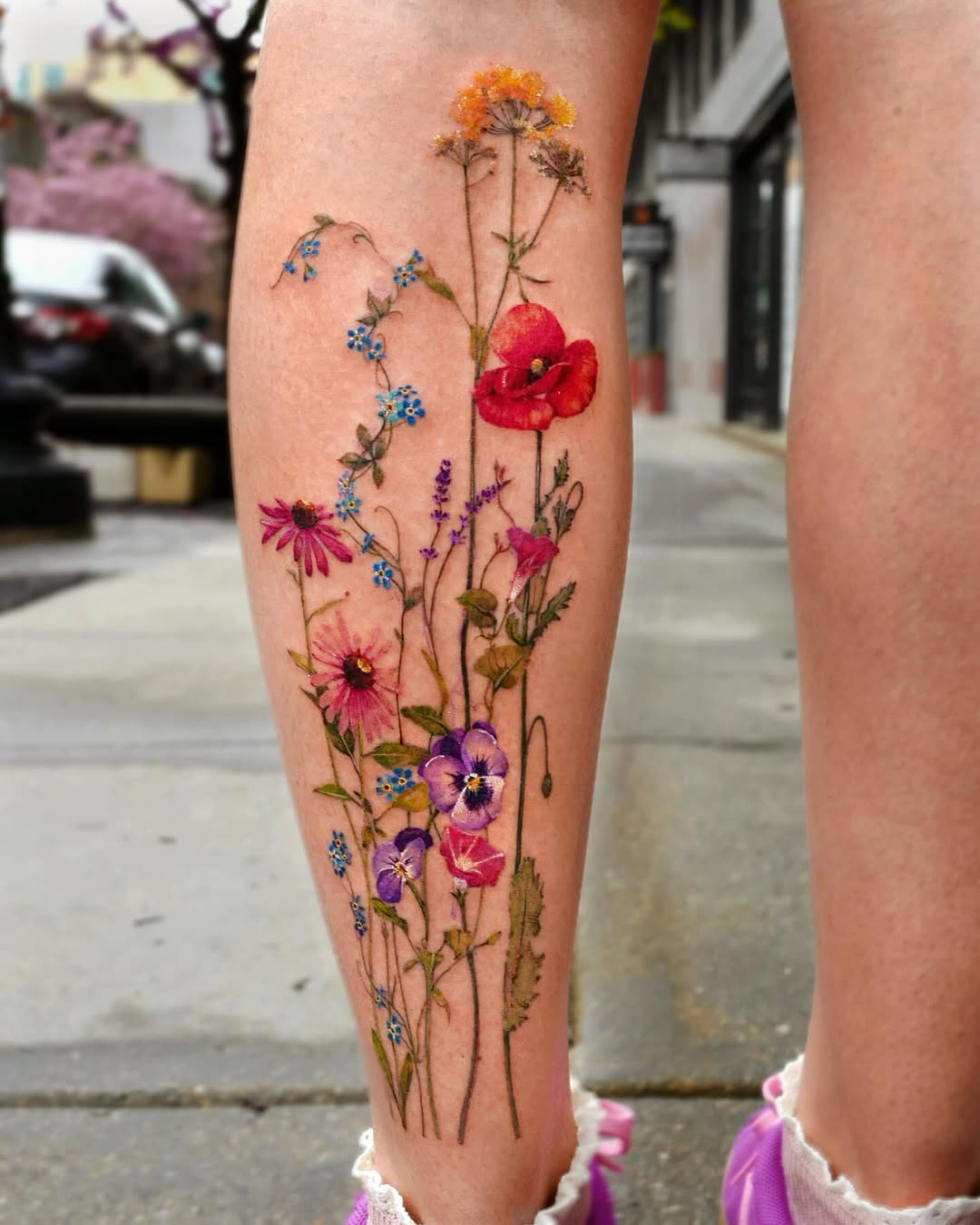 Vibrant floral tattoo showcasing natural beauty.
