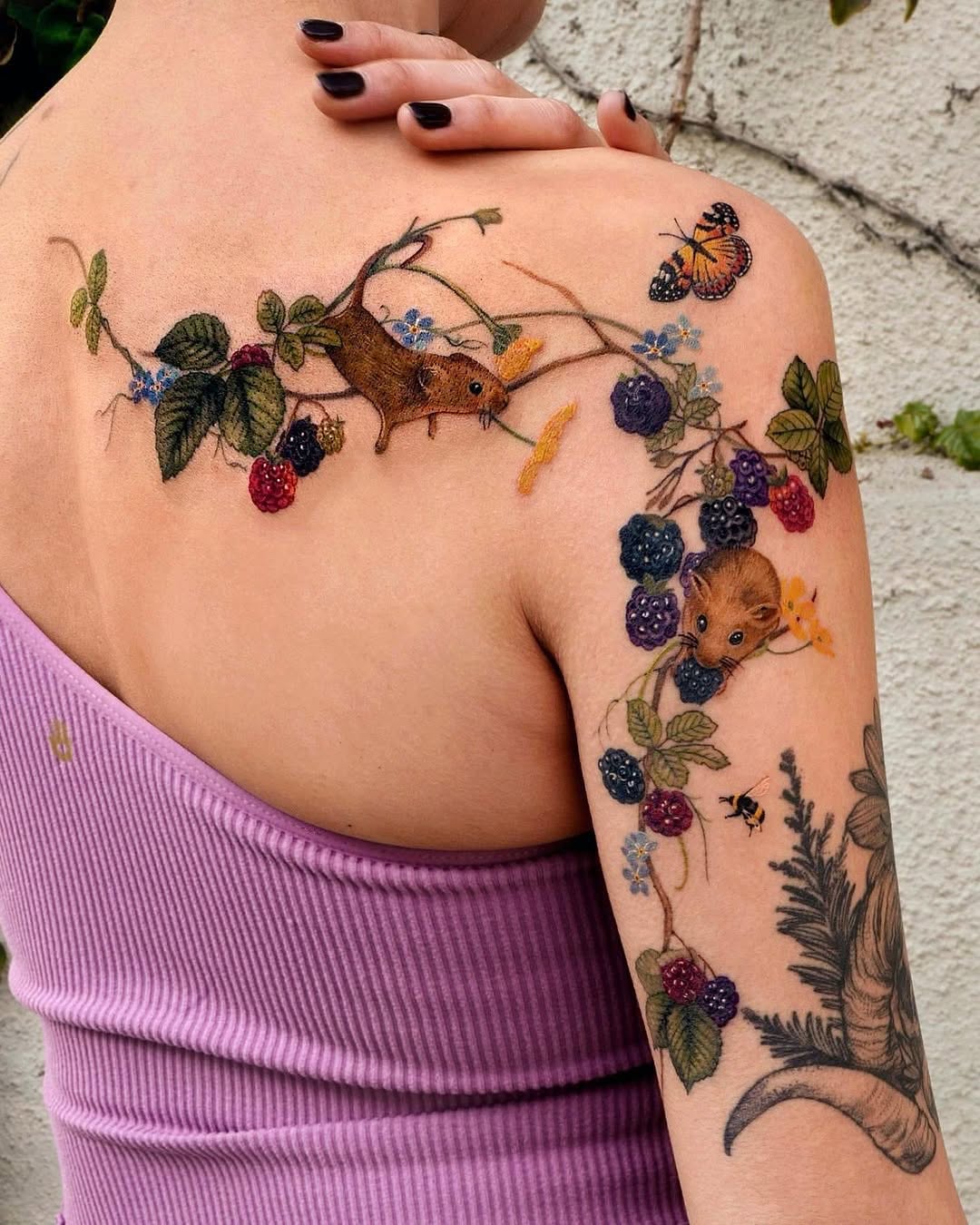 Whimsical forest creatures shoulder tattoo design.