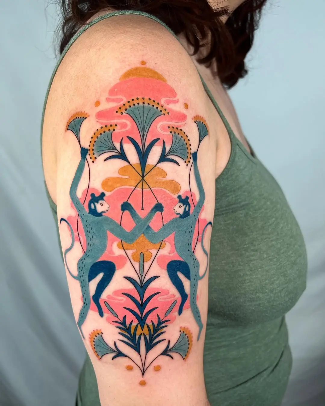 Colorful monkey tattoo with floral accents
