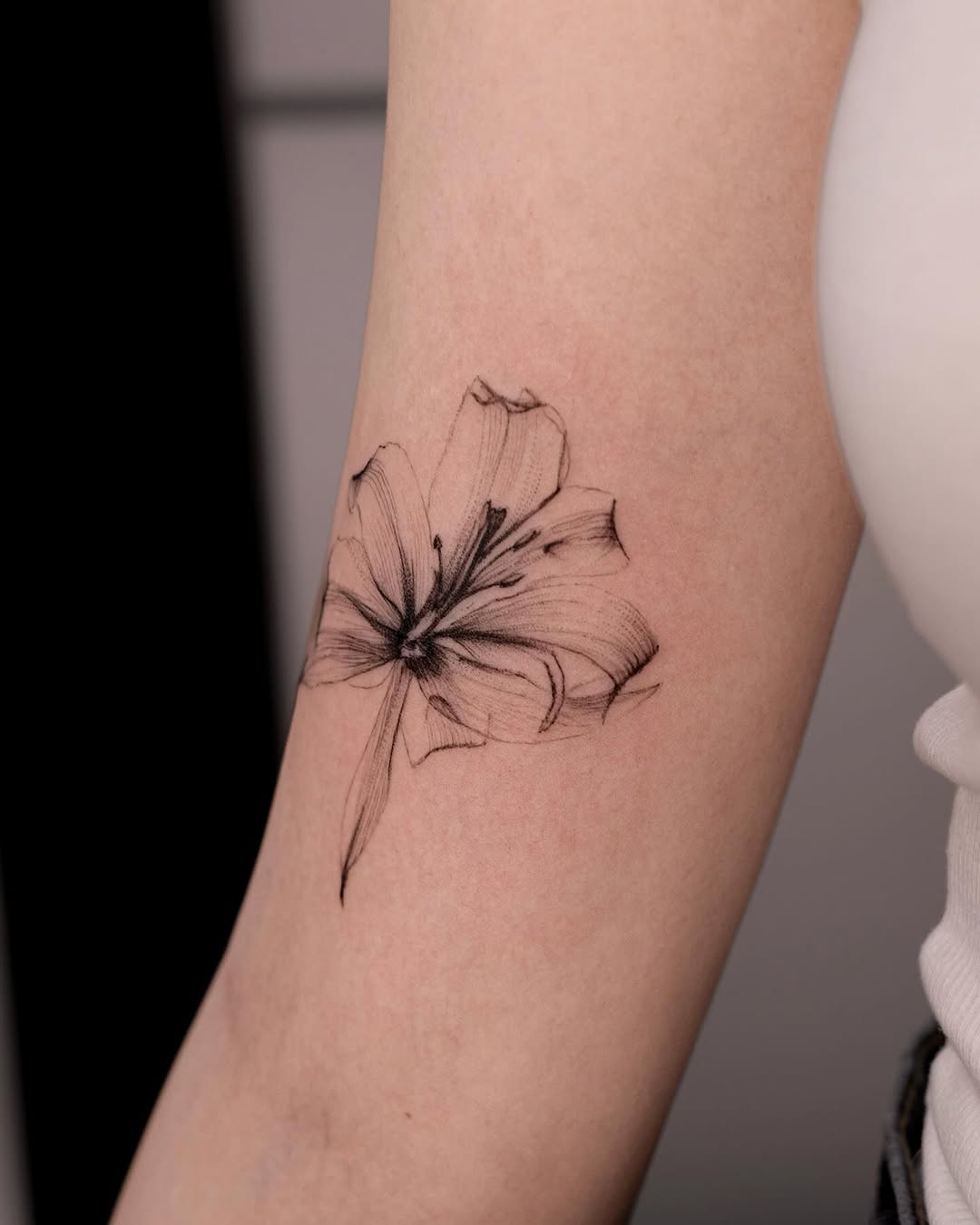 Stunning black flower tattoo with fine details