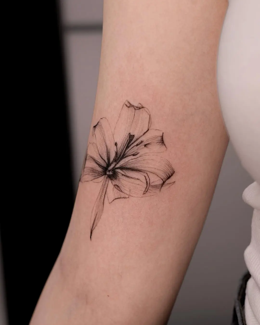 Stunning black flower tattoo with fine details