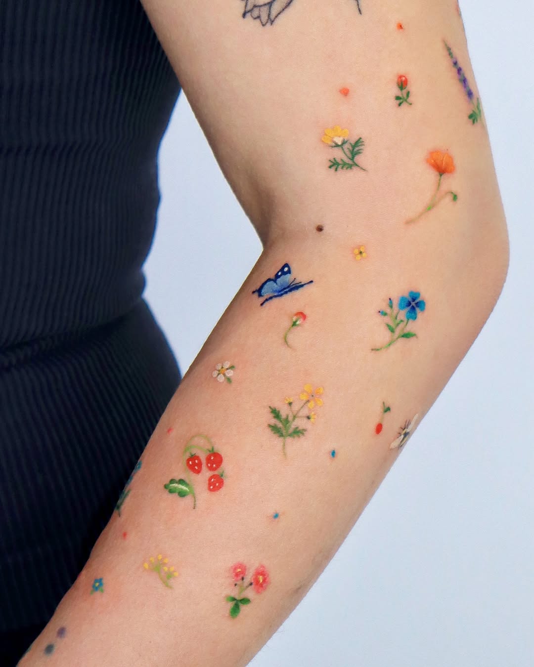 Charming Small Floral Tattoos on the Arm