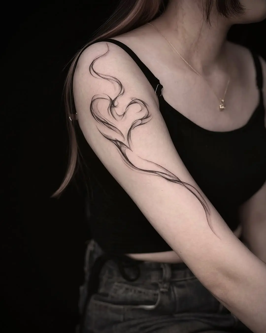Elegant heart tattoo with flowing lines