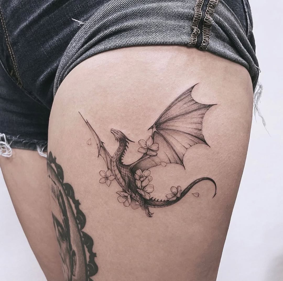 Elegant dragon tattoo with floral elements