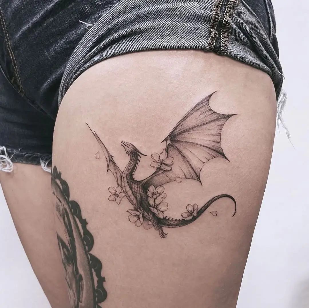 Elegant dragon tattoo with floral elements