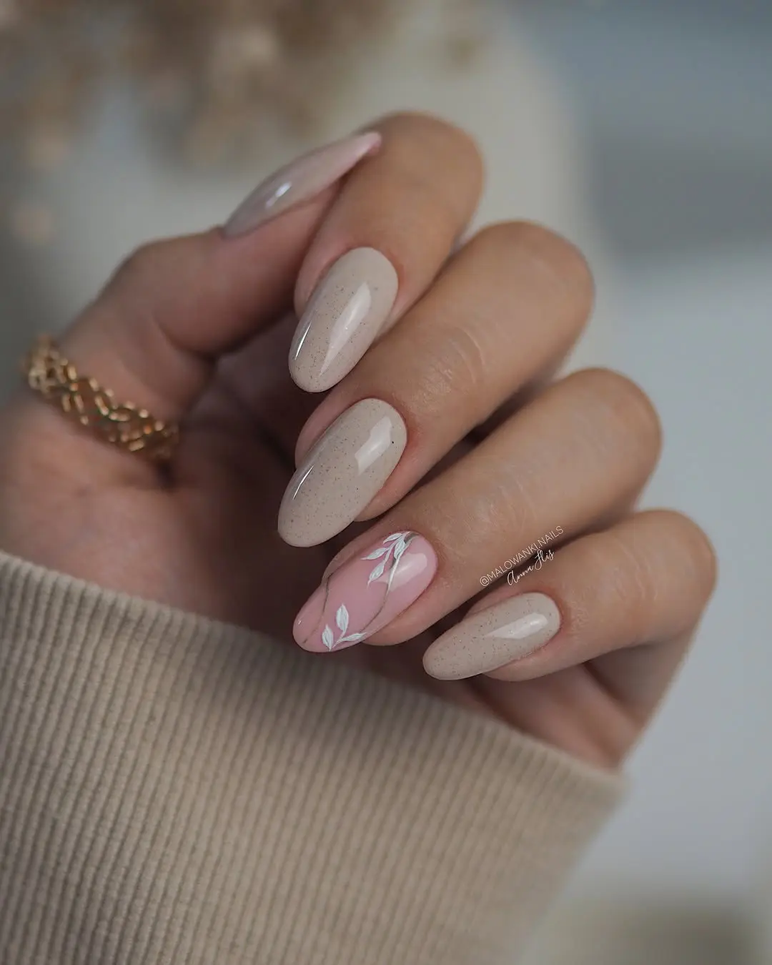 Elegant beige nails with floral accents
