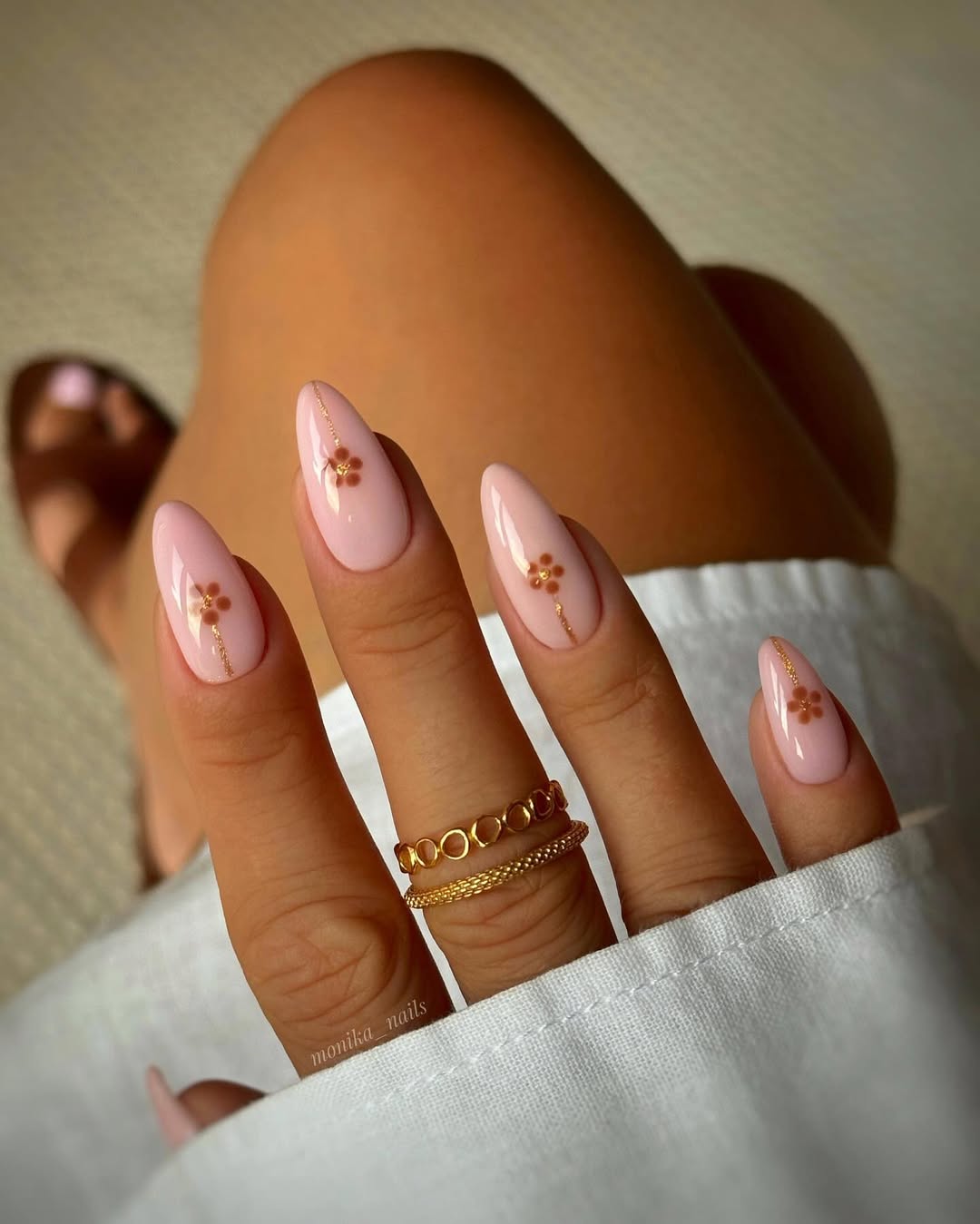 Chic beige nails with delicate floral accents