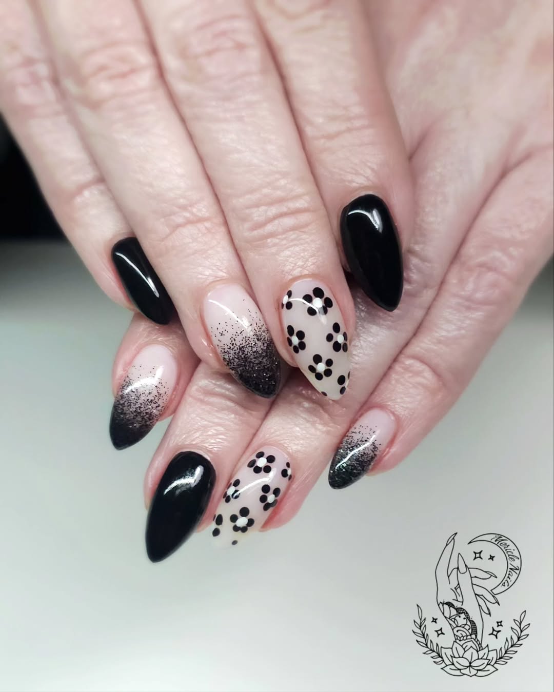 Stunning black nail art with floral designs