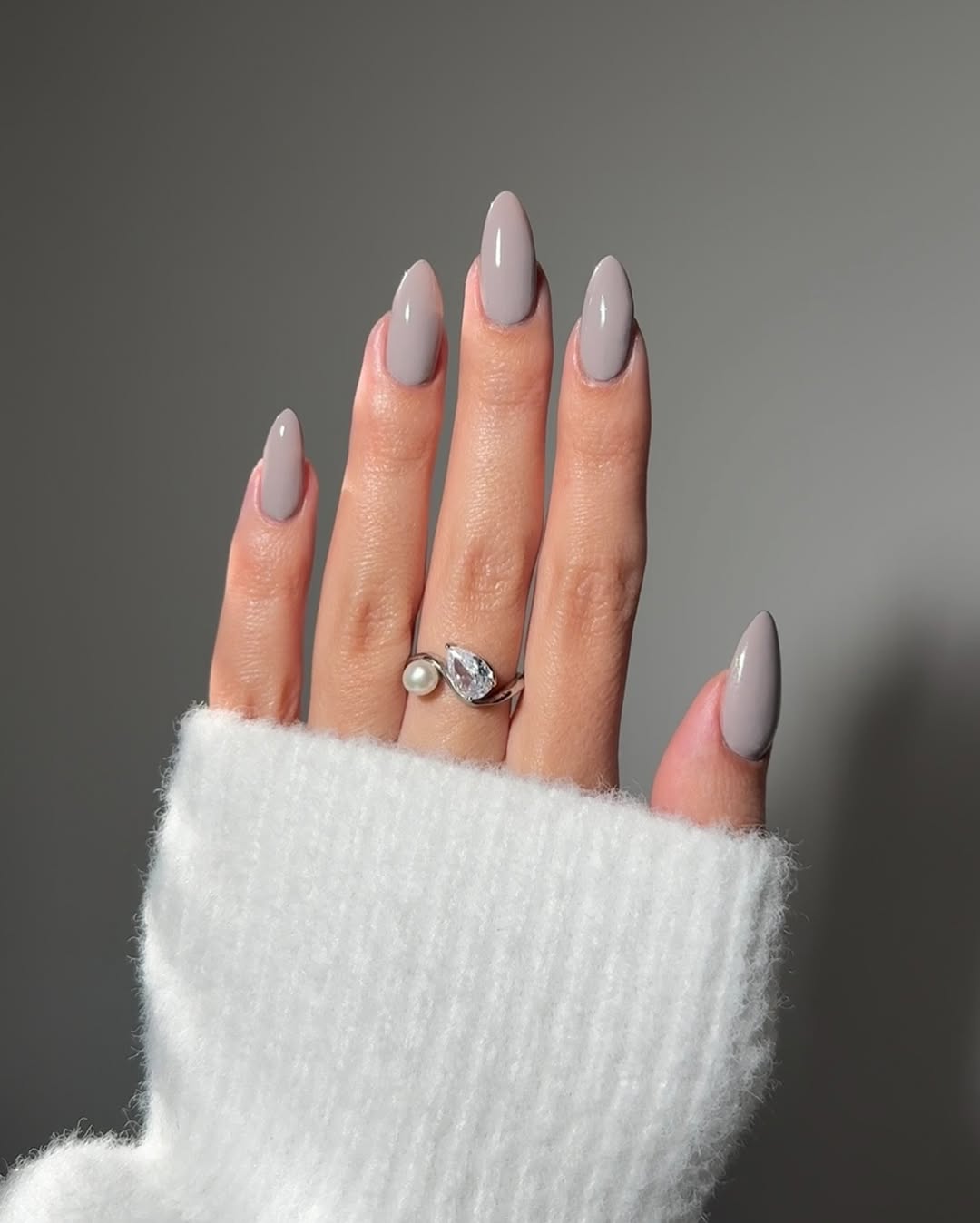 Chic grey nails with elegant accessories