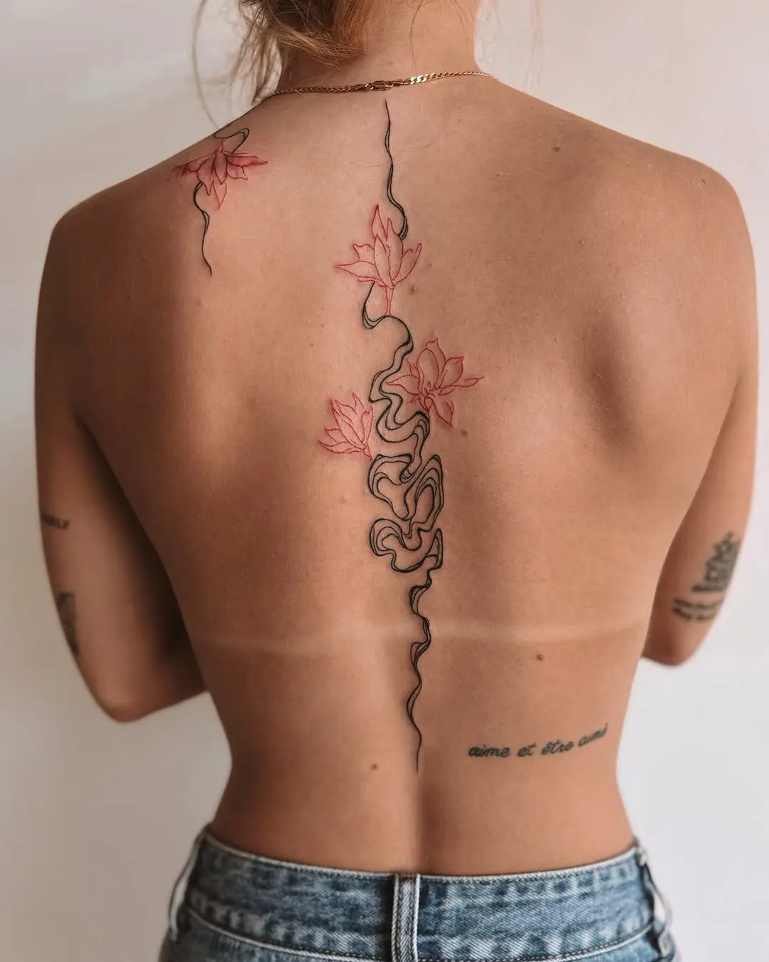Elegant fine line tattoo showcasing natural beauty
