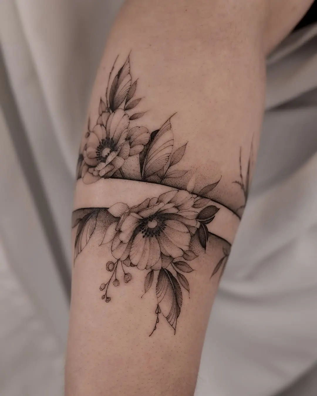 Delicate floral fine line tattoo design