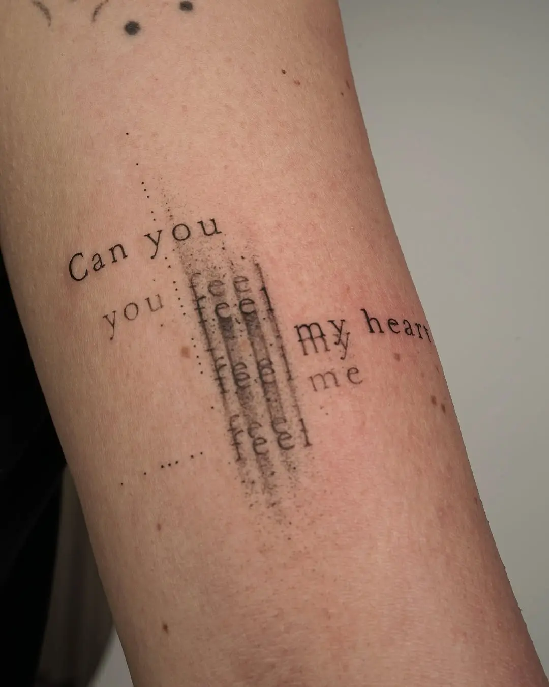 Textual fine line tattoo with emotional impact