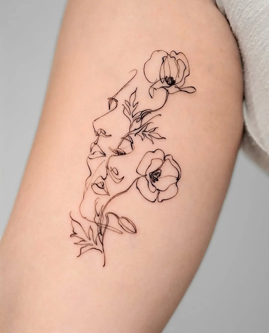 Elegant depiction of faces with floral elements